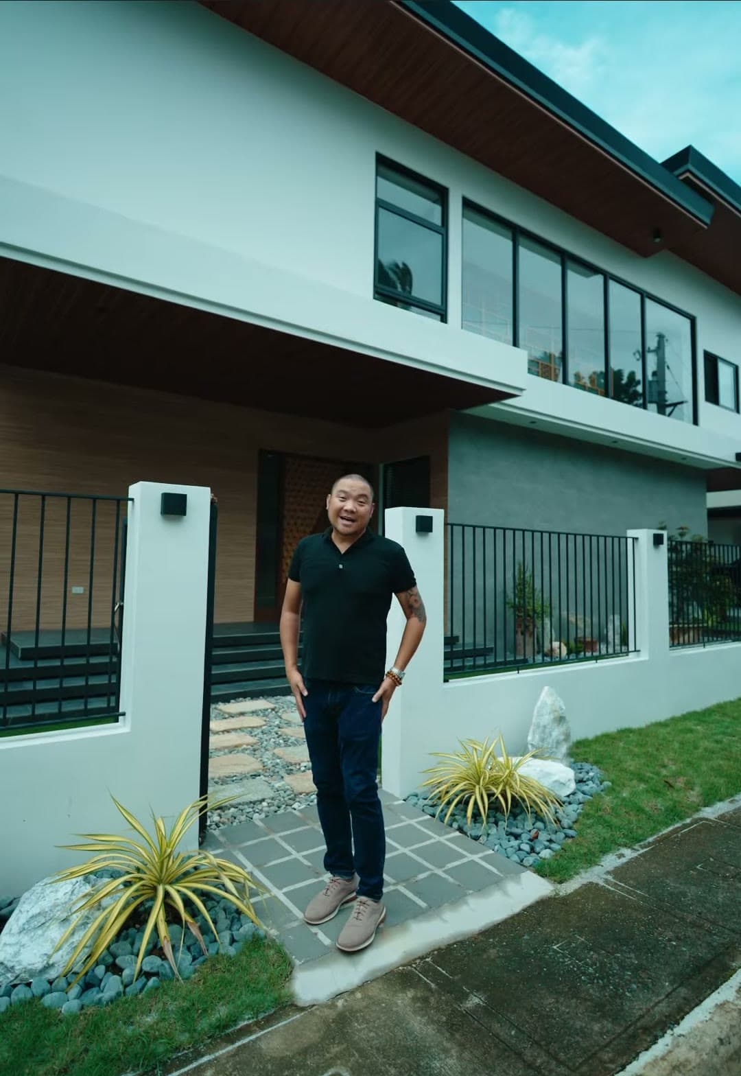 Kuya Erick of Keystone in front of a completed home