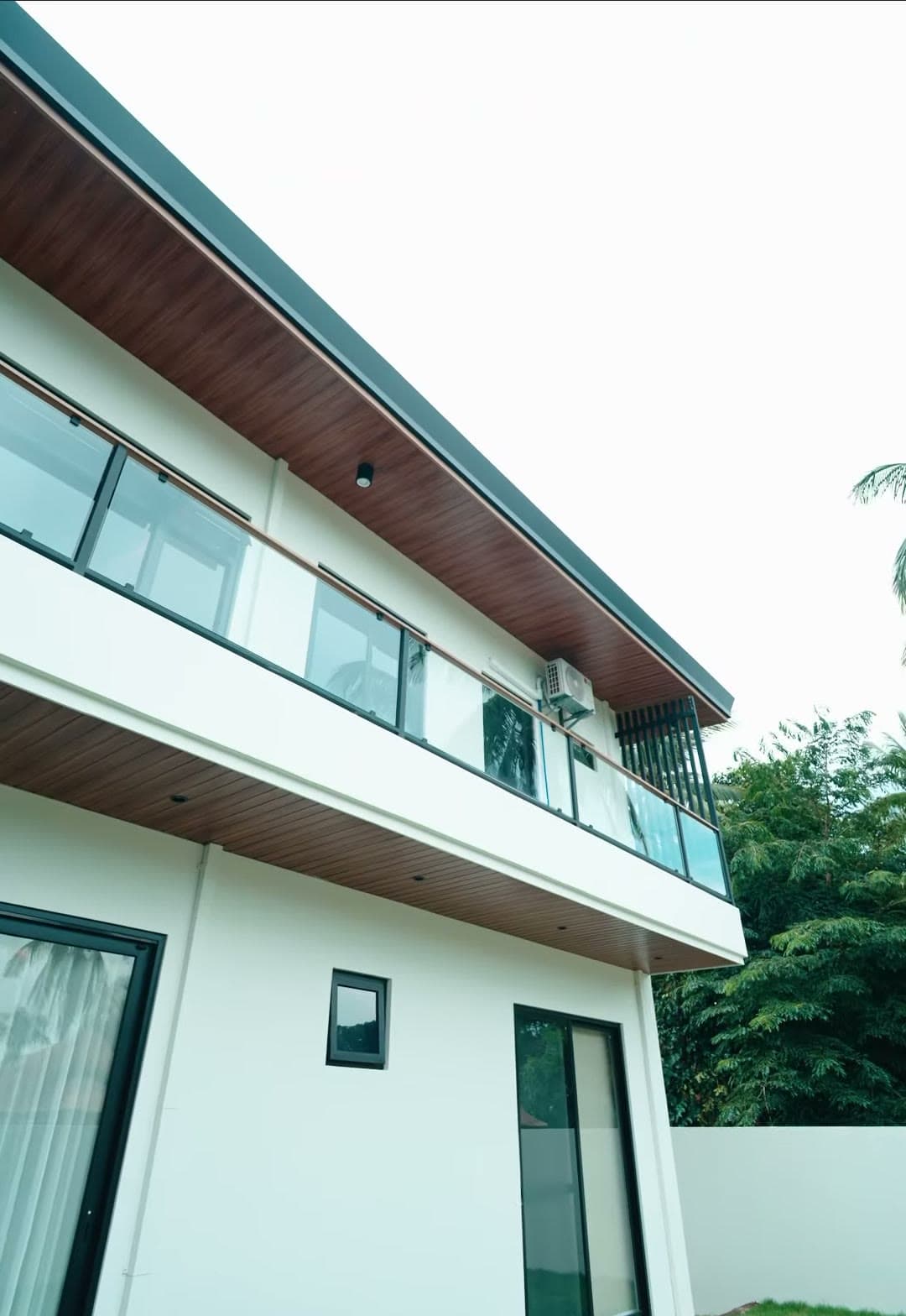 Upper-floor balcony with glass railing